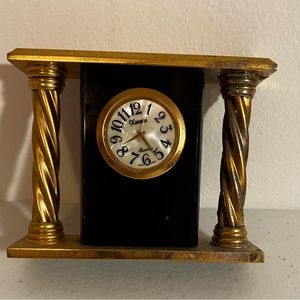 Mini mantle quartz clock.  Brass and onyx maybe marble. Just needs battery